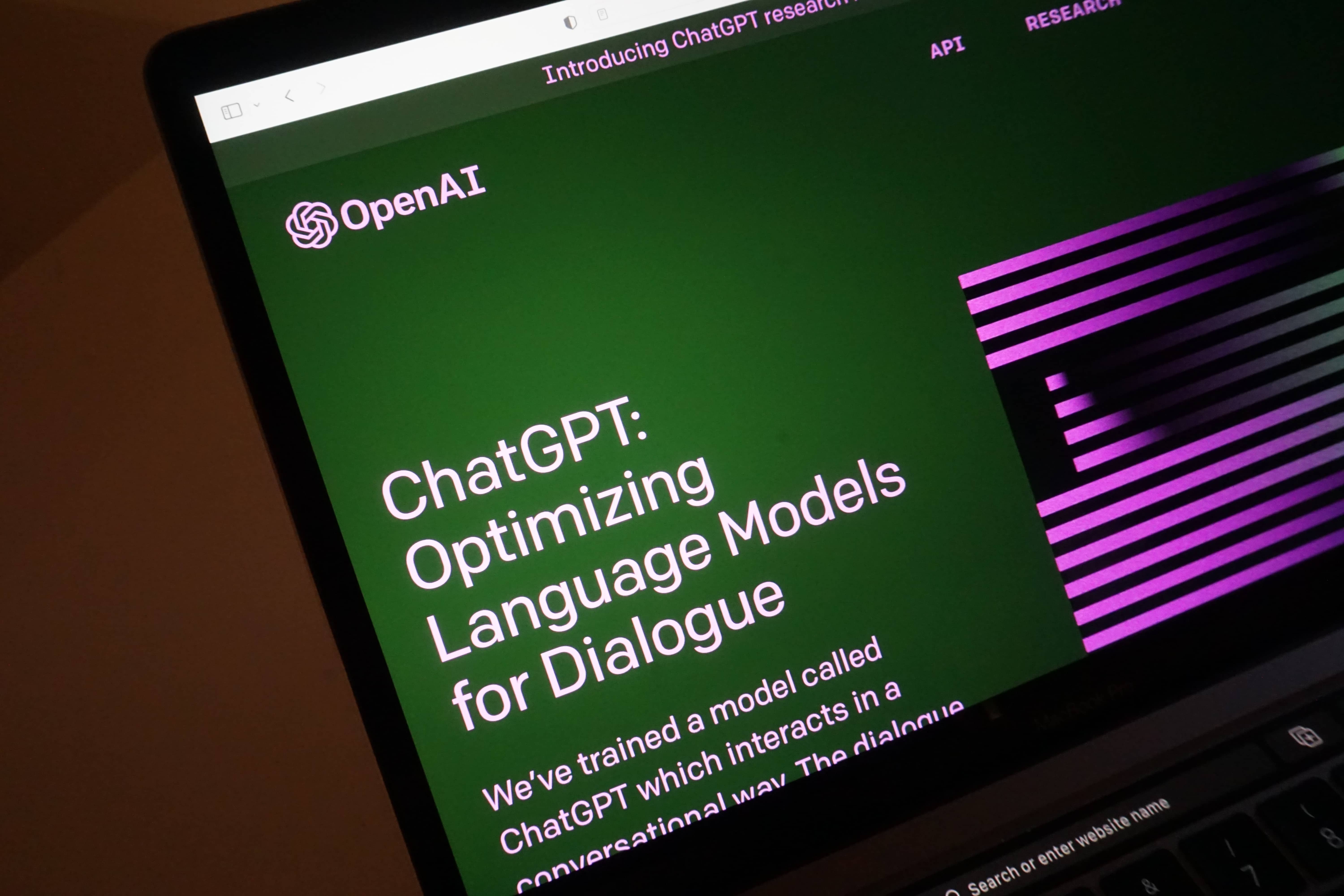 A laptop computer screen showing OpenAi's ChatGPT product page