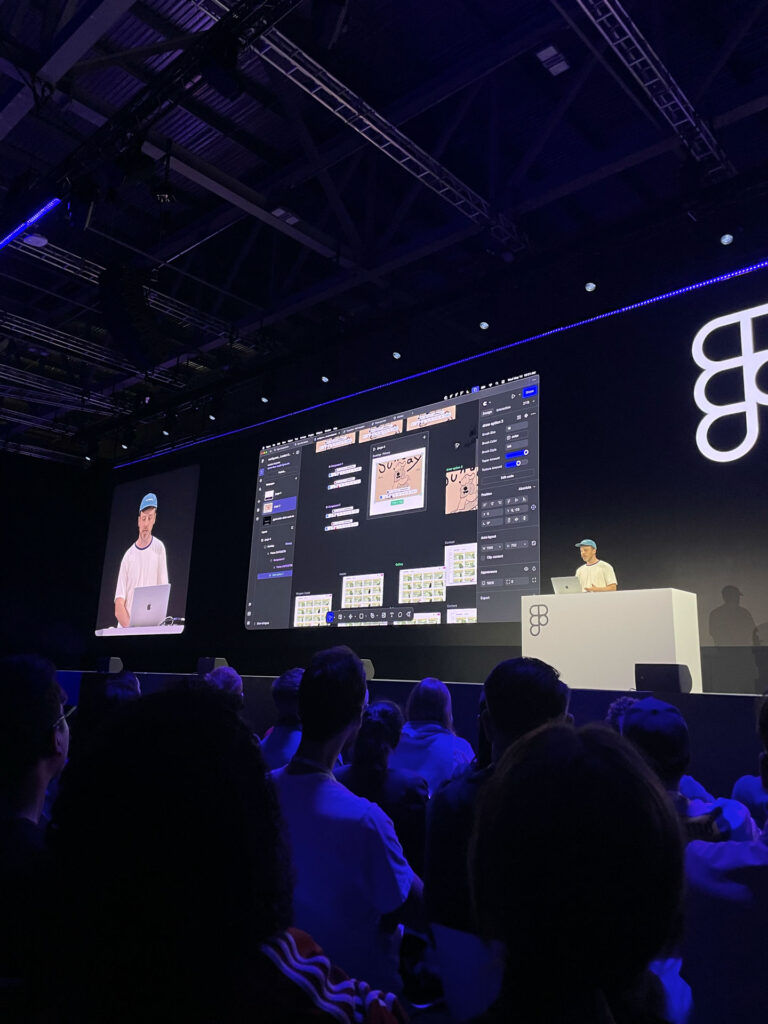 Niko presenting on stage at Figma Config 2025, the new Figma product sites in front of a large audience. The screen behind shows insights into the new products.
